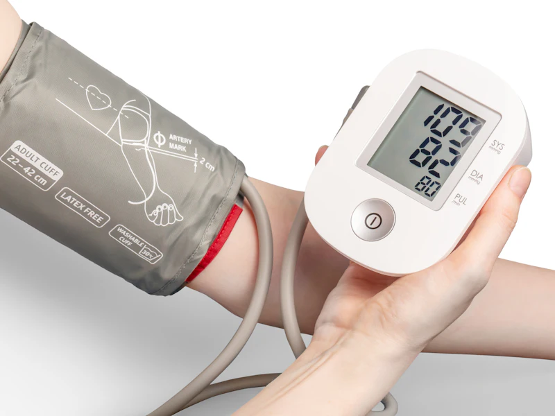 Checking a patient’s blood pressure during a home visit